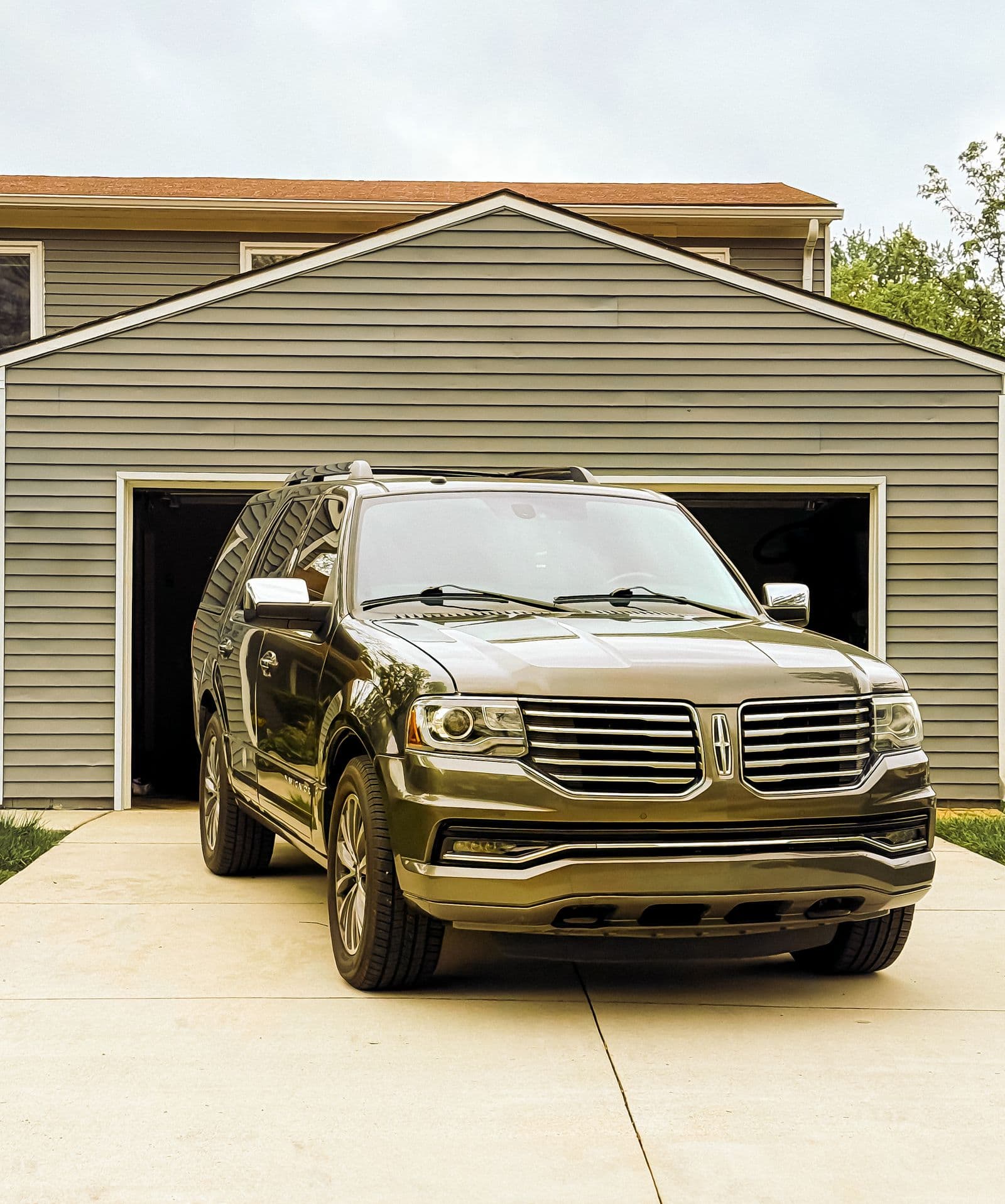 A vehicle parked in a driveway, ready to be covered
